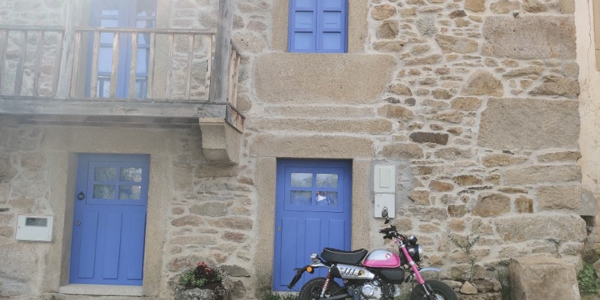 Blue wooden door on stone house