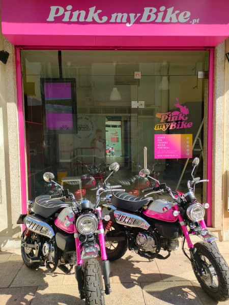 A pink shop with pink motorcycles