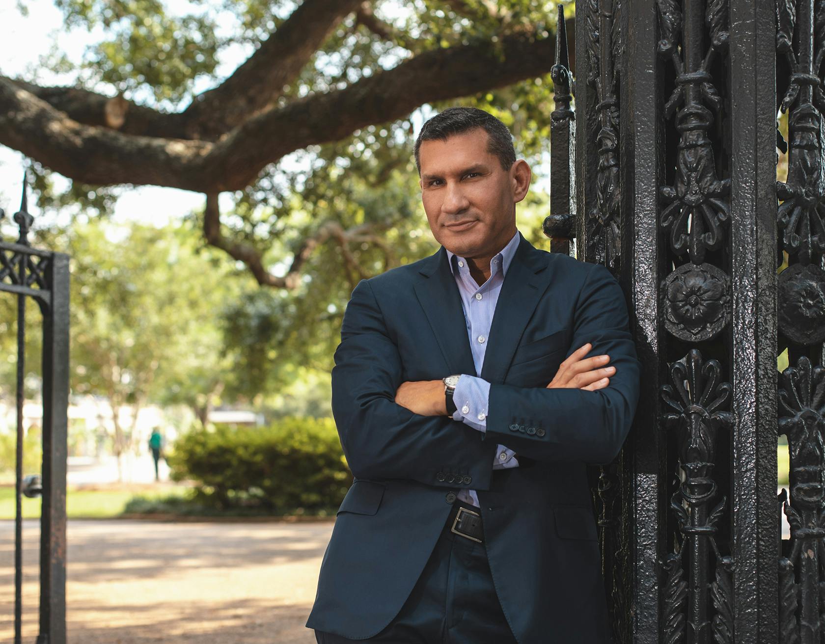 Dr. Miller Standing in Front of a Gate