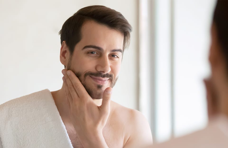 Man Looking at His Complexion