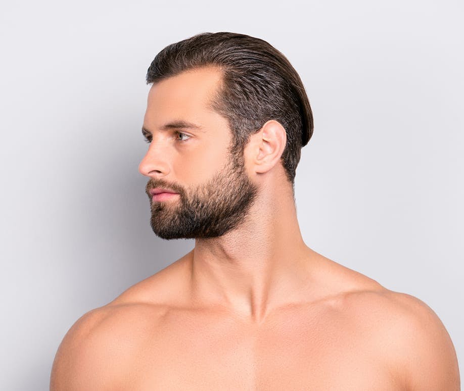 Shirtless man with slicked back hair and a beard