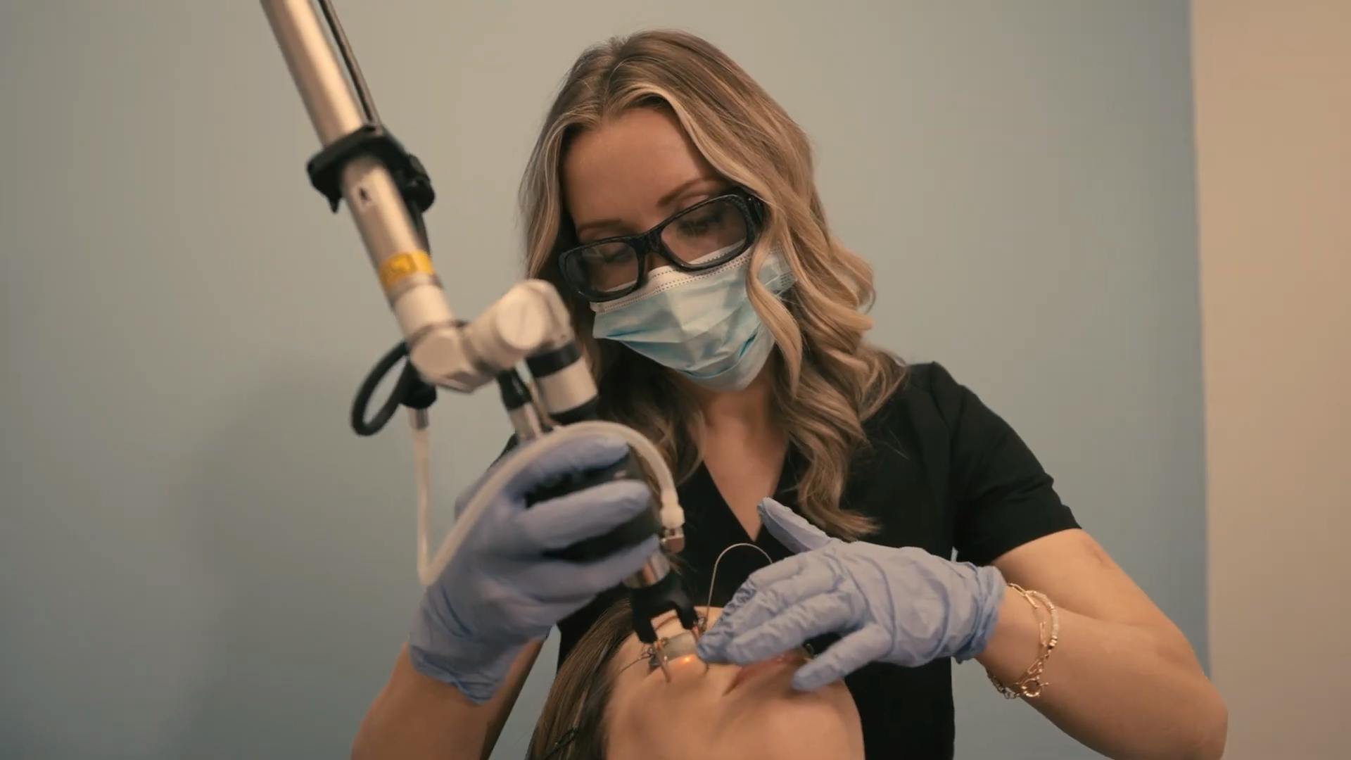 Staff at Surface Medspa performing procedure on the face