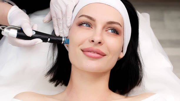 woman receiving a hydrafacial