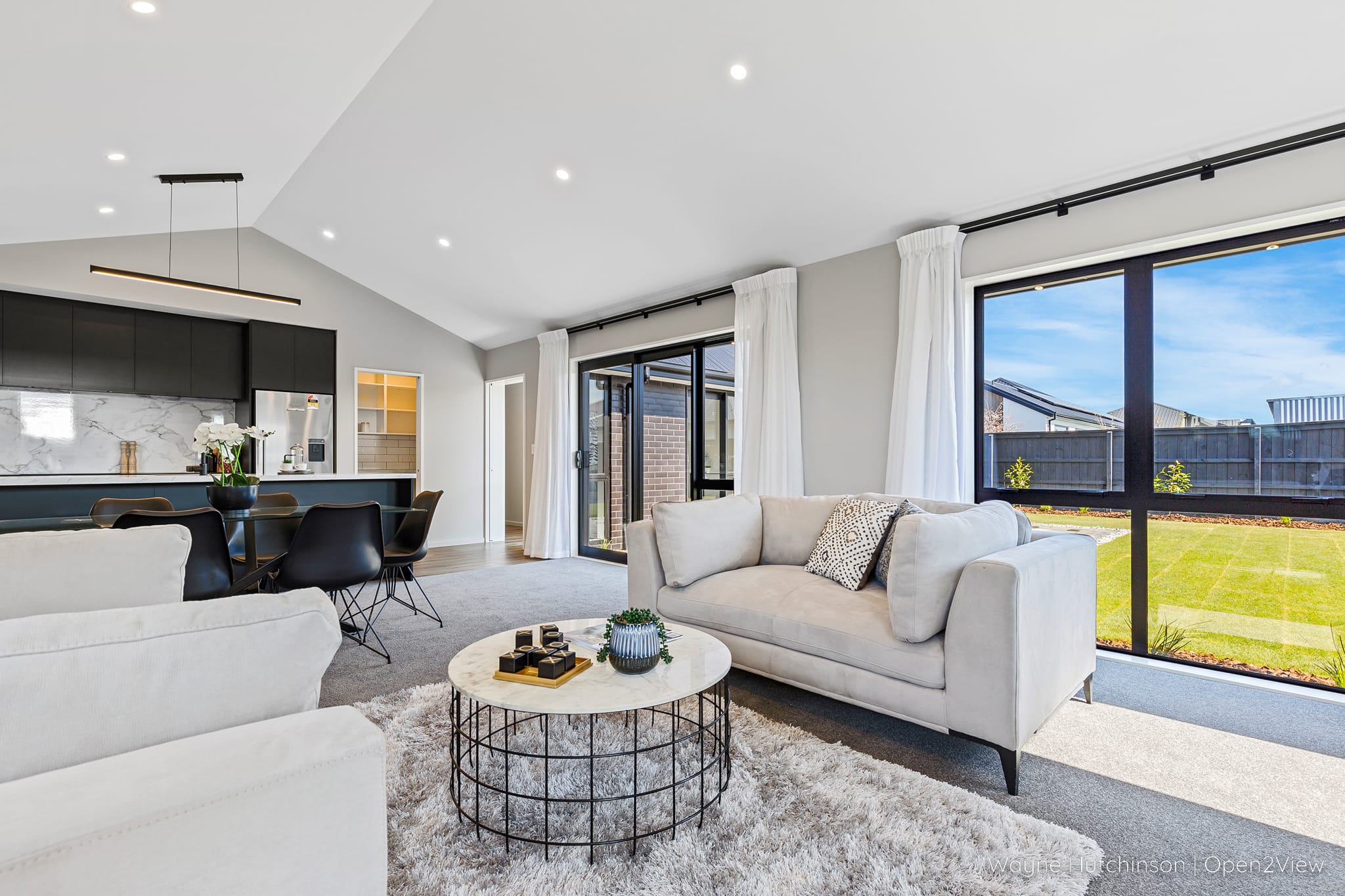 James Place - furniture, table, indoors, living room, room, housing, coffee table, rug, lobby, couch