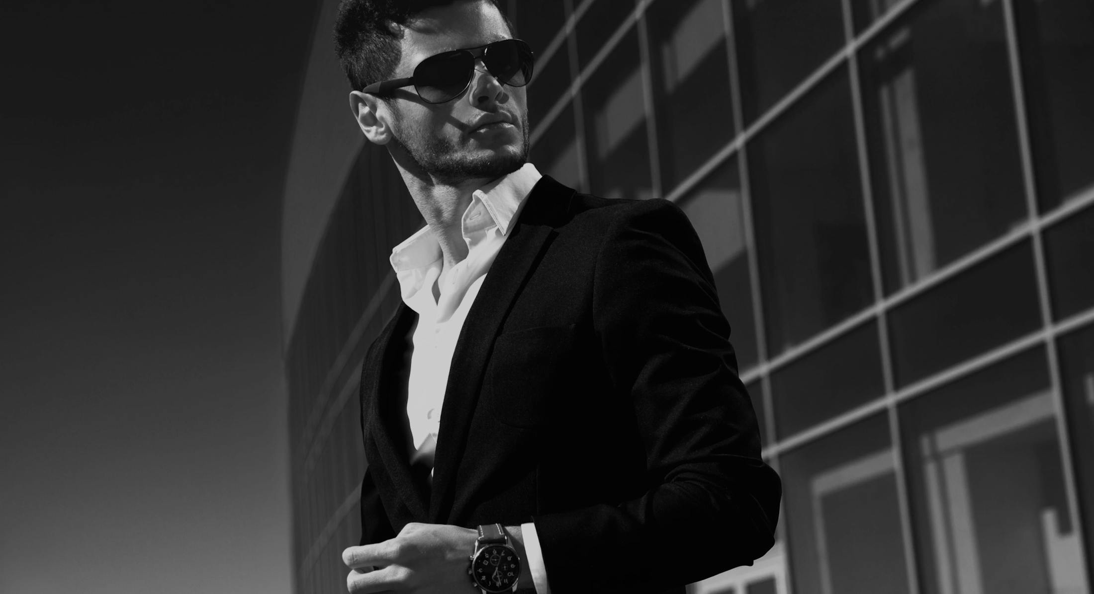 man in suit wearing sunglasses