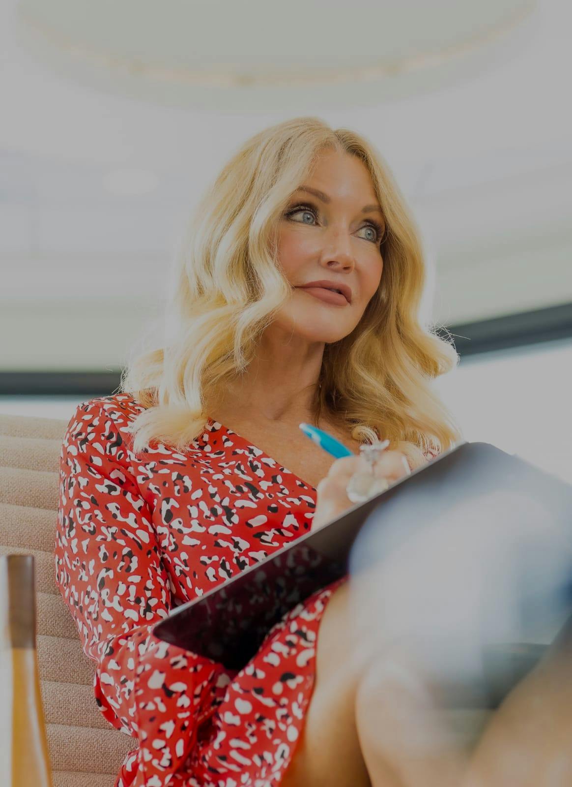 Blonde woman filling out a form