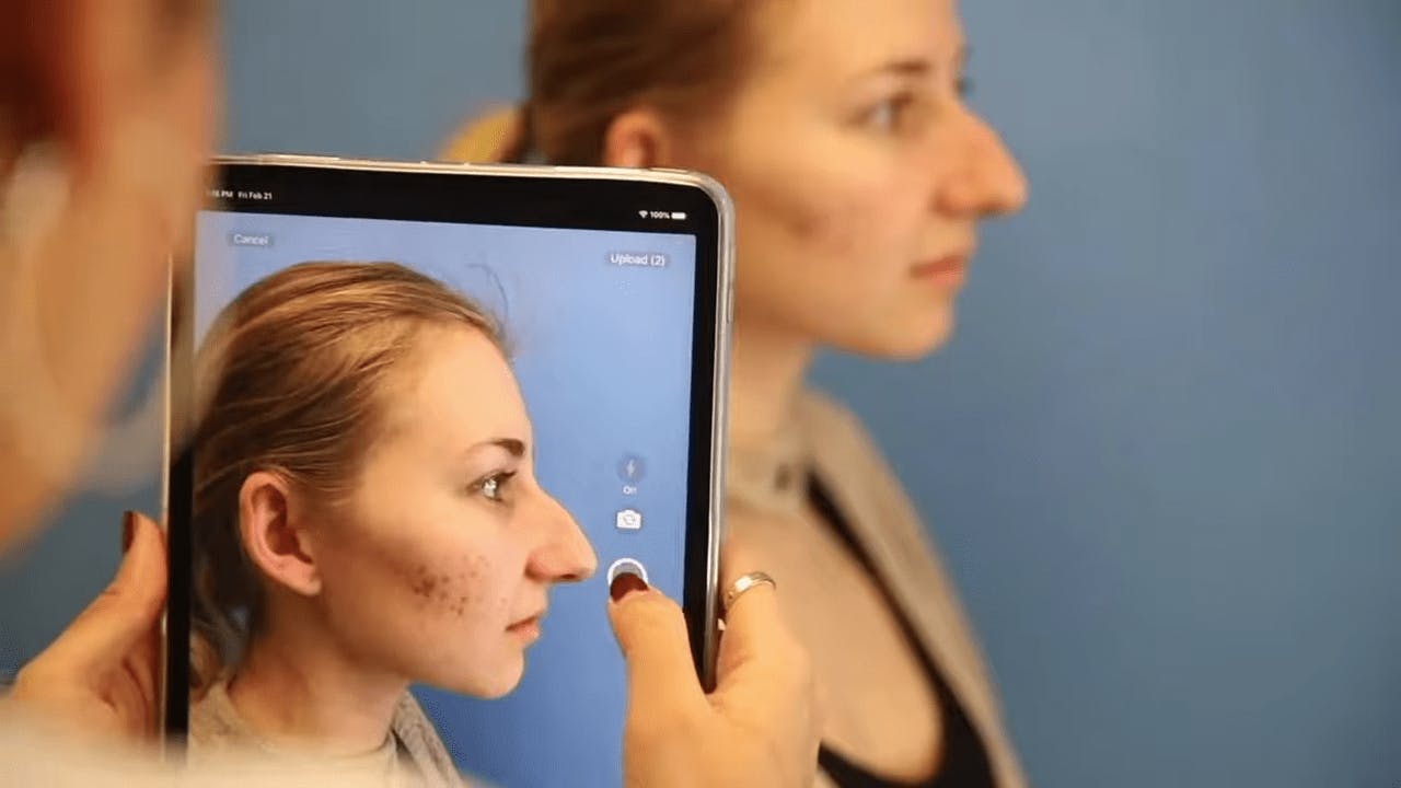 Woman Getting Her Picture Taken with a Tablet