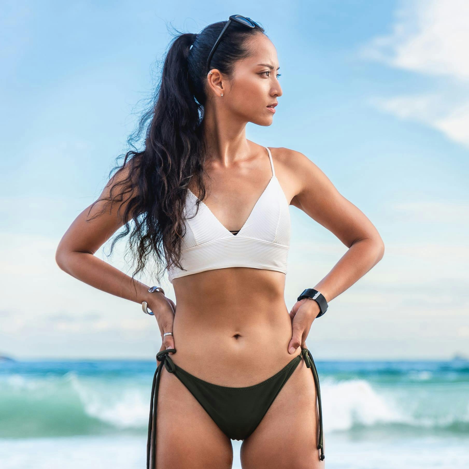 Woman Standing in Front of the Ocean in Swimsuit