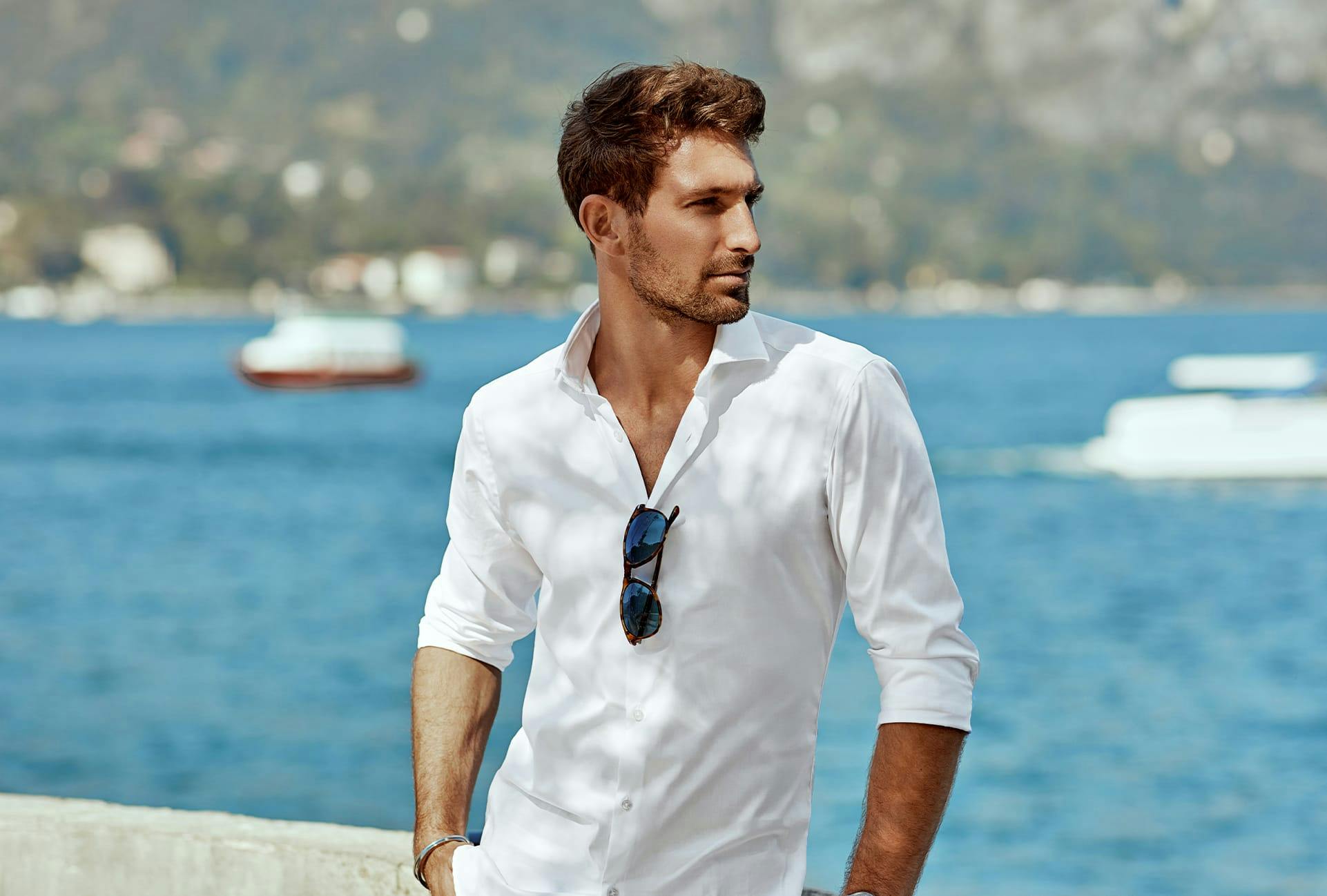 Handsome Man Posing with the Ocean Behind Him