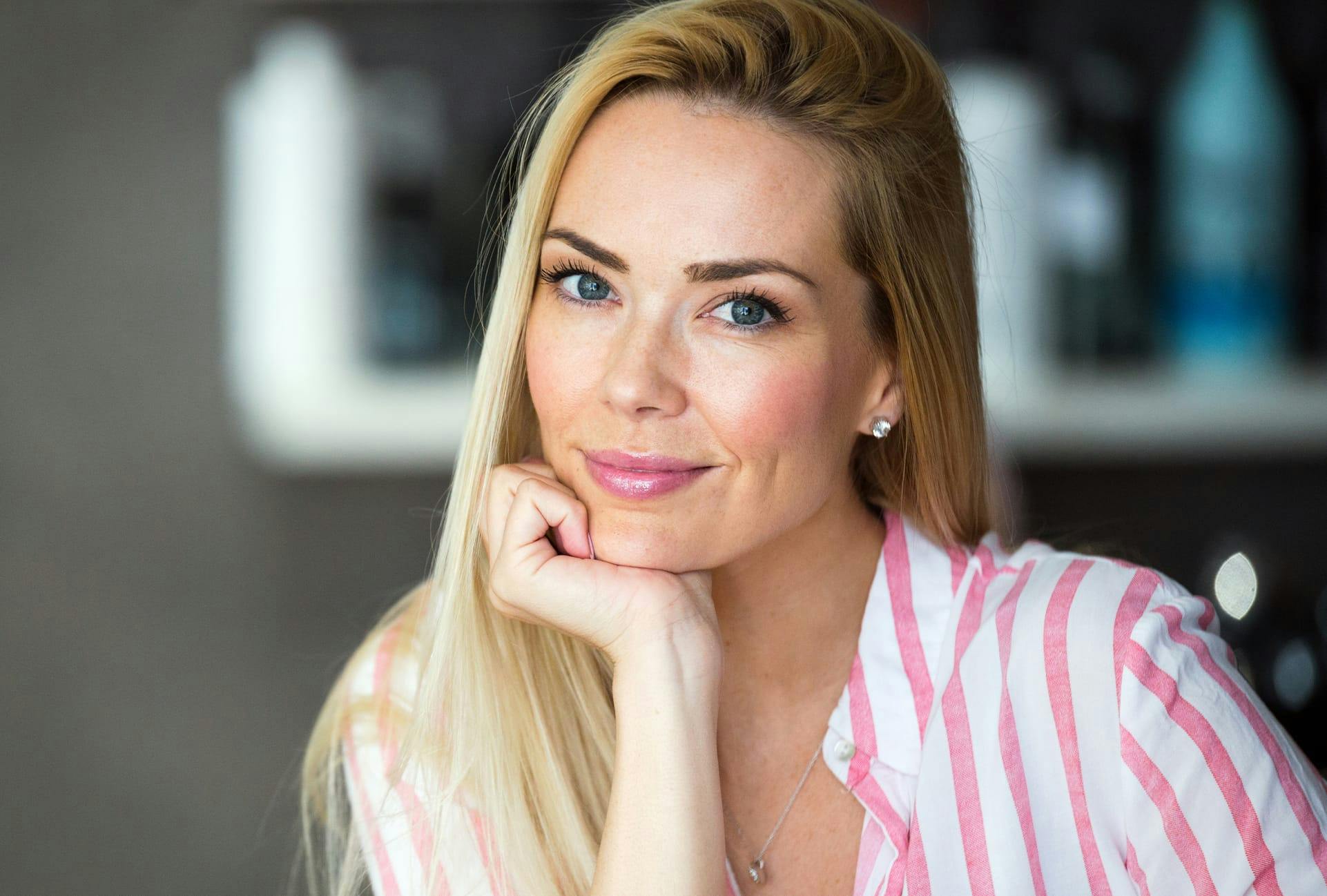 Woman wearing a pink and white striped shirt