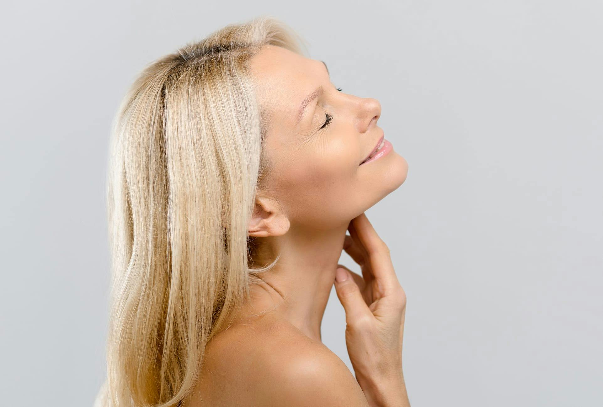 Woman with Blonde Hair Leaning her Head Back