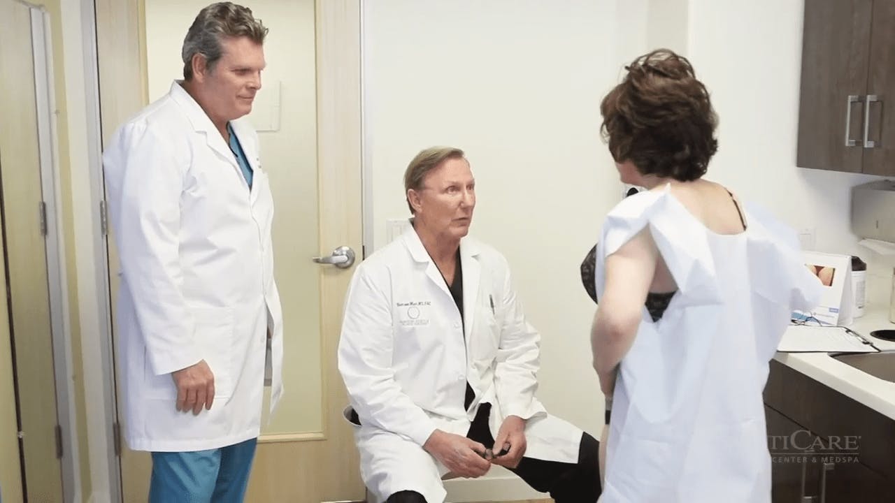 Doctors Talking to Patient