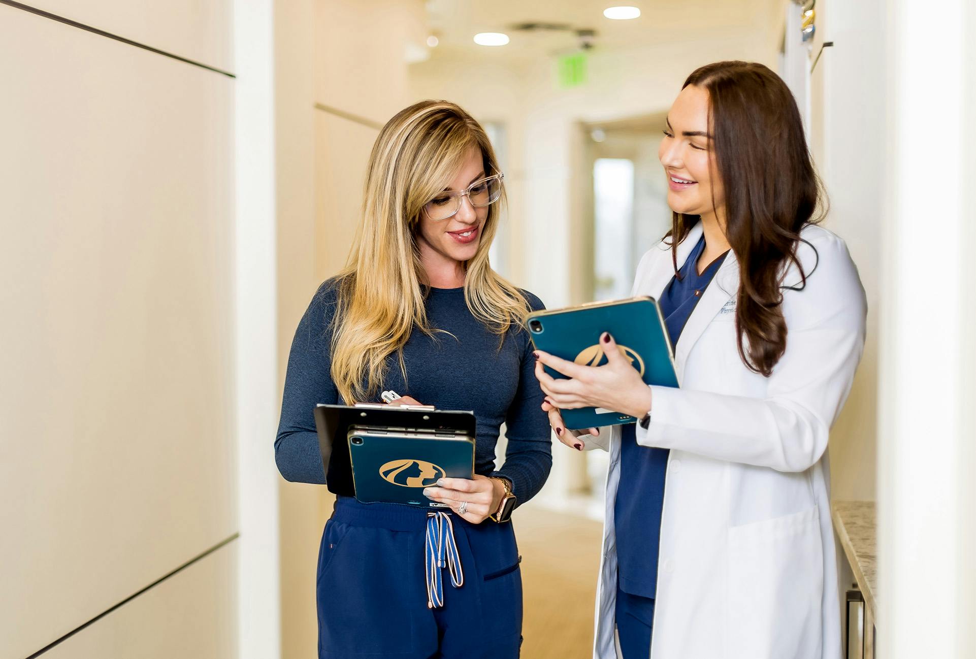 Patien and Doctor Walking with Clipboards