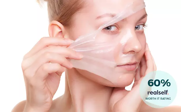 Woman Peeling Off a Face Mask