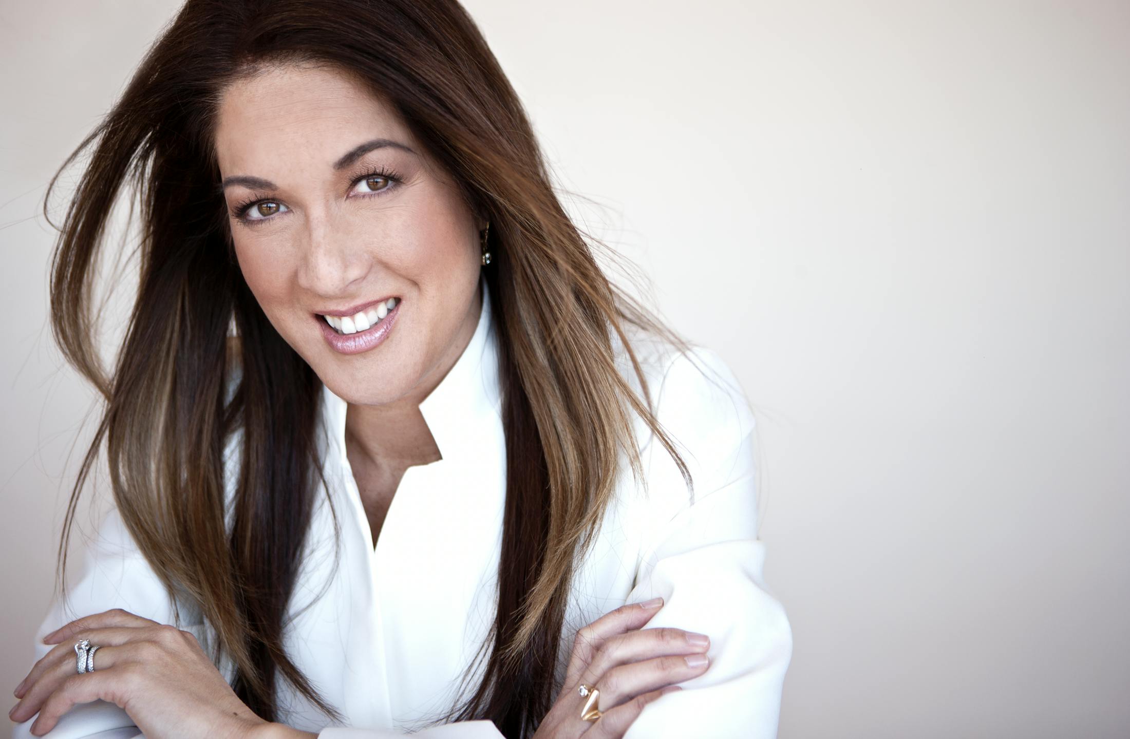 Woman with Her Arms Crossed and Long Brown Hair