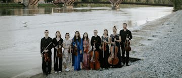 Chamber group of musicians at the Drava Bridge in maribor