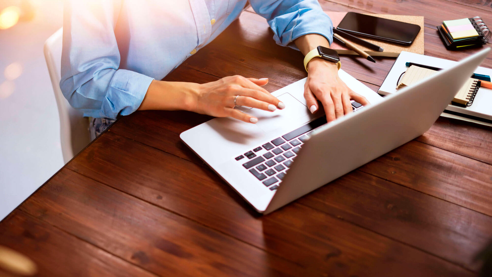 woman sitting with laptop at table