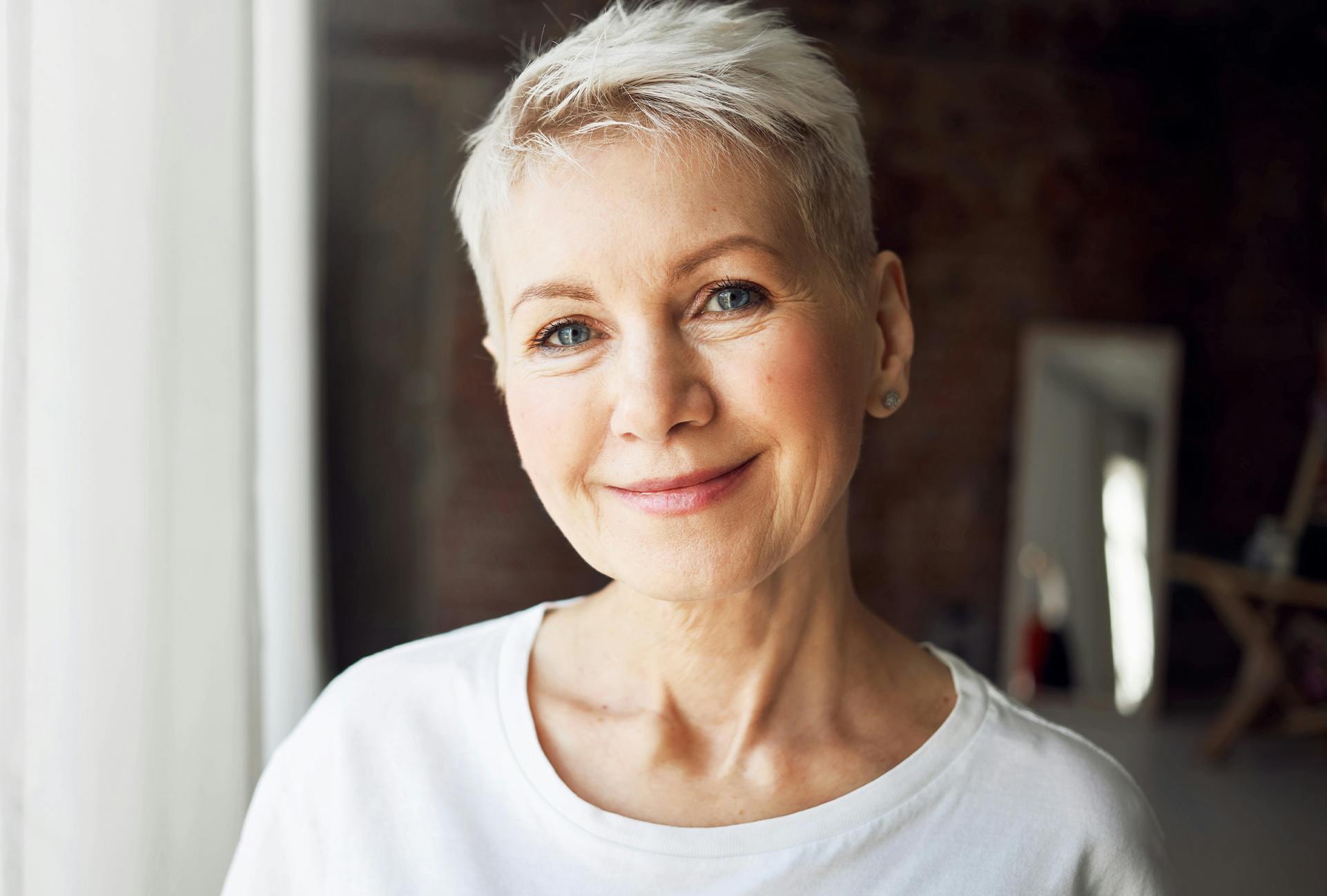 Woman with a pixie haircut smiling