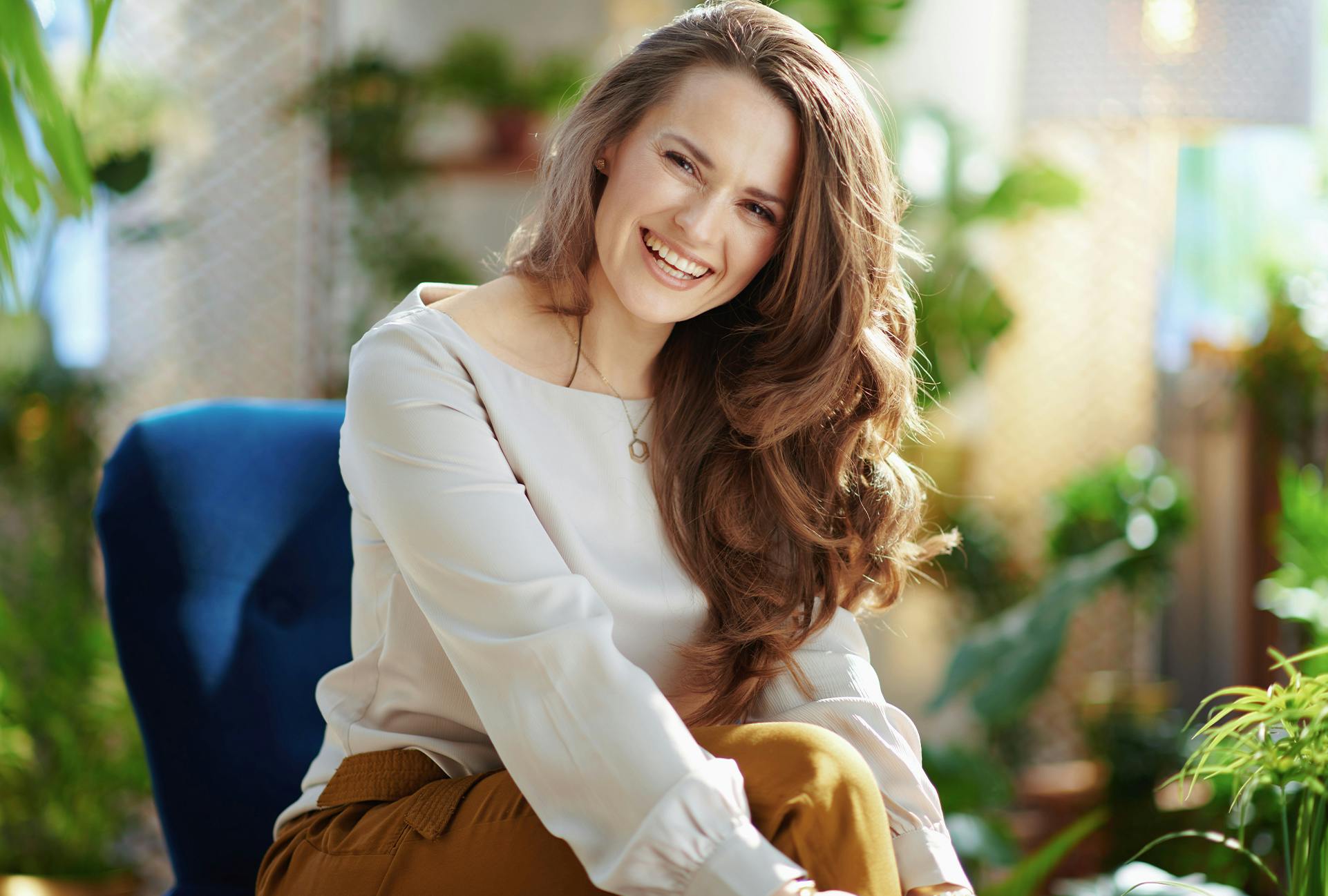 Woman with a big smile sitting down