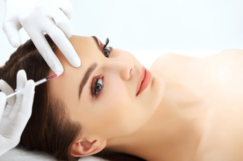 woman getting injectable treatment