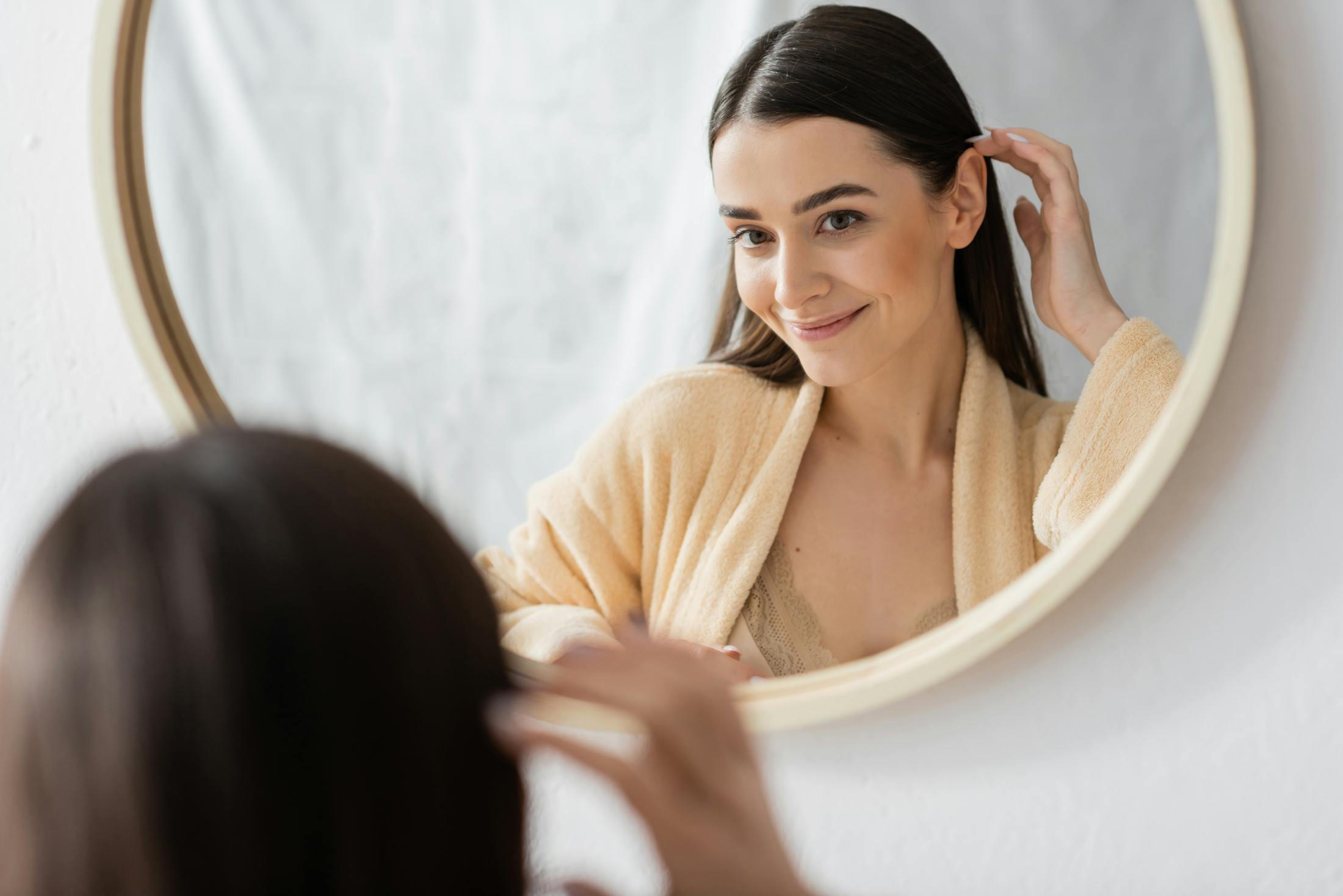 Woman looking in a mirror