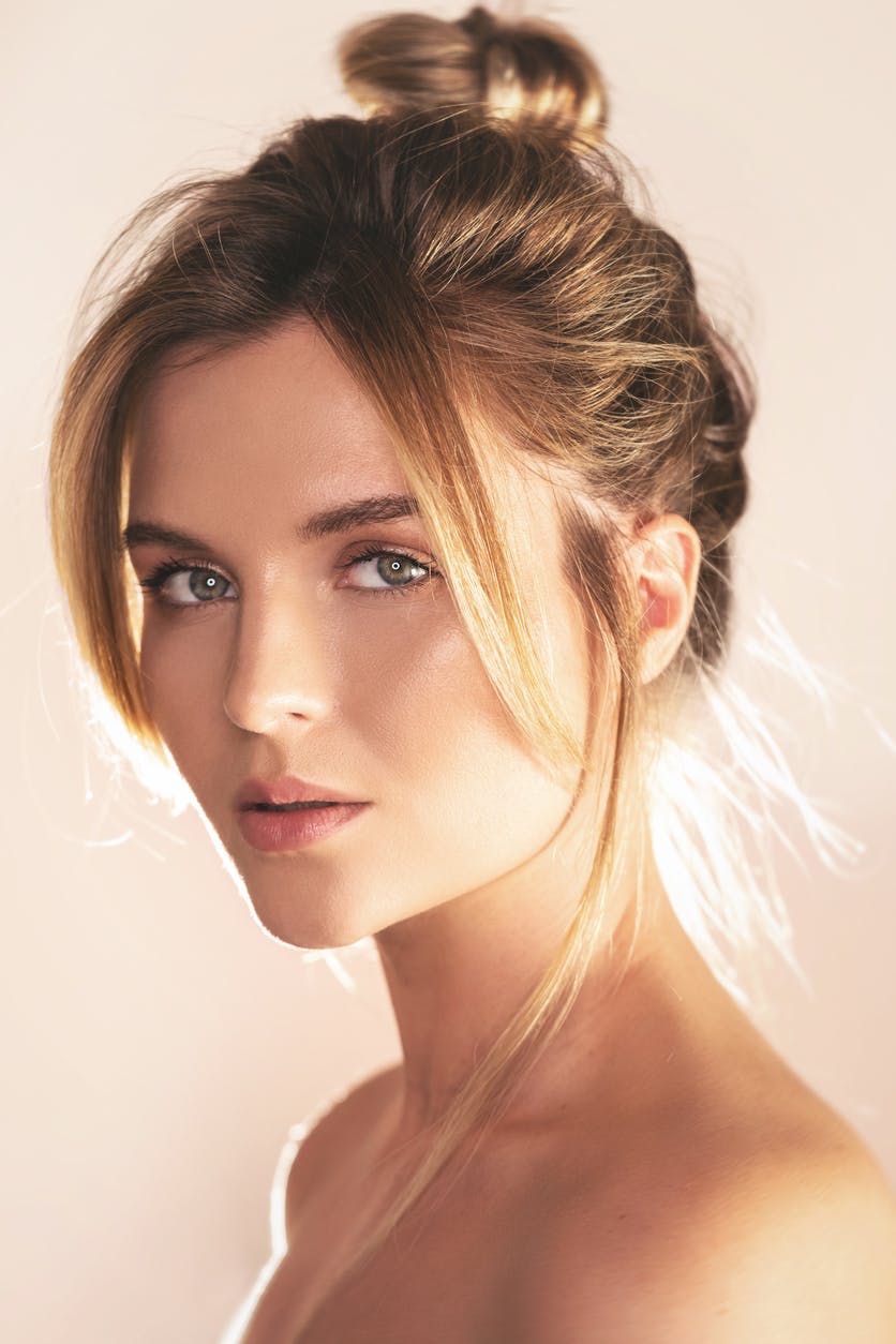 woman with her hair in a bun