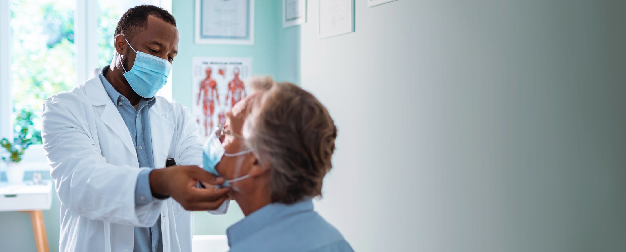 Male doctor examining patient