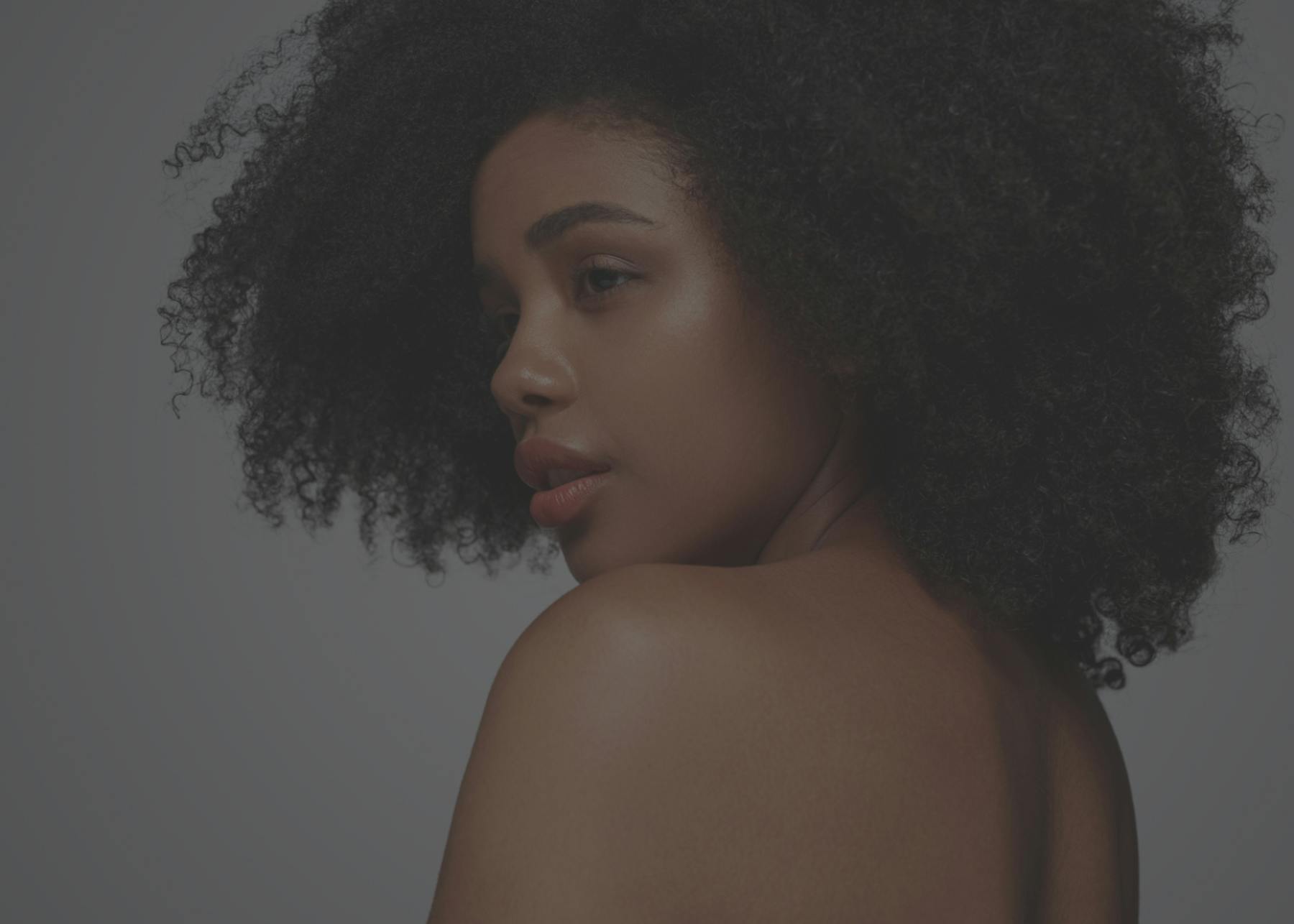 A background image showing a black model