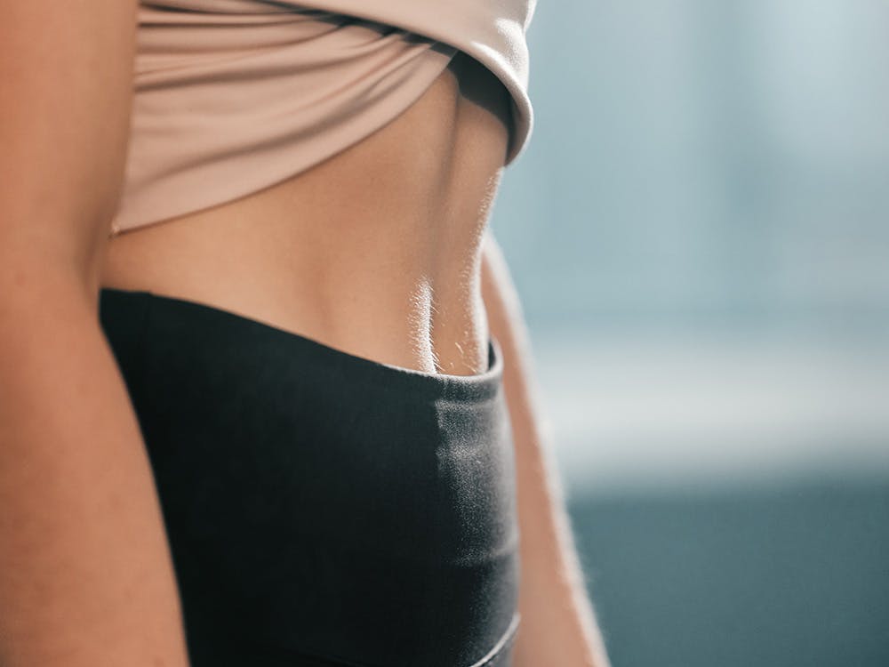 A woman with toned and flat tummy