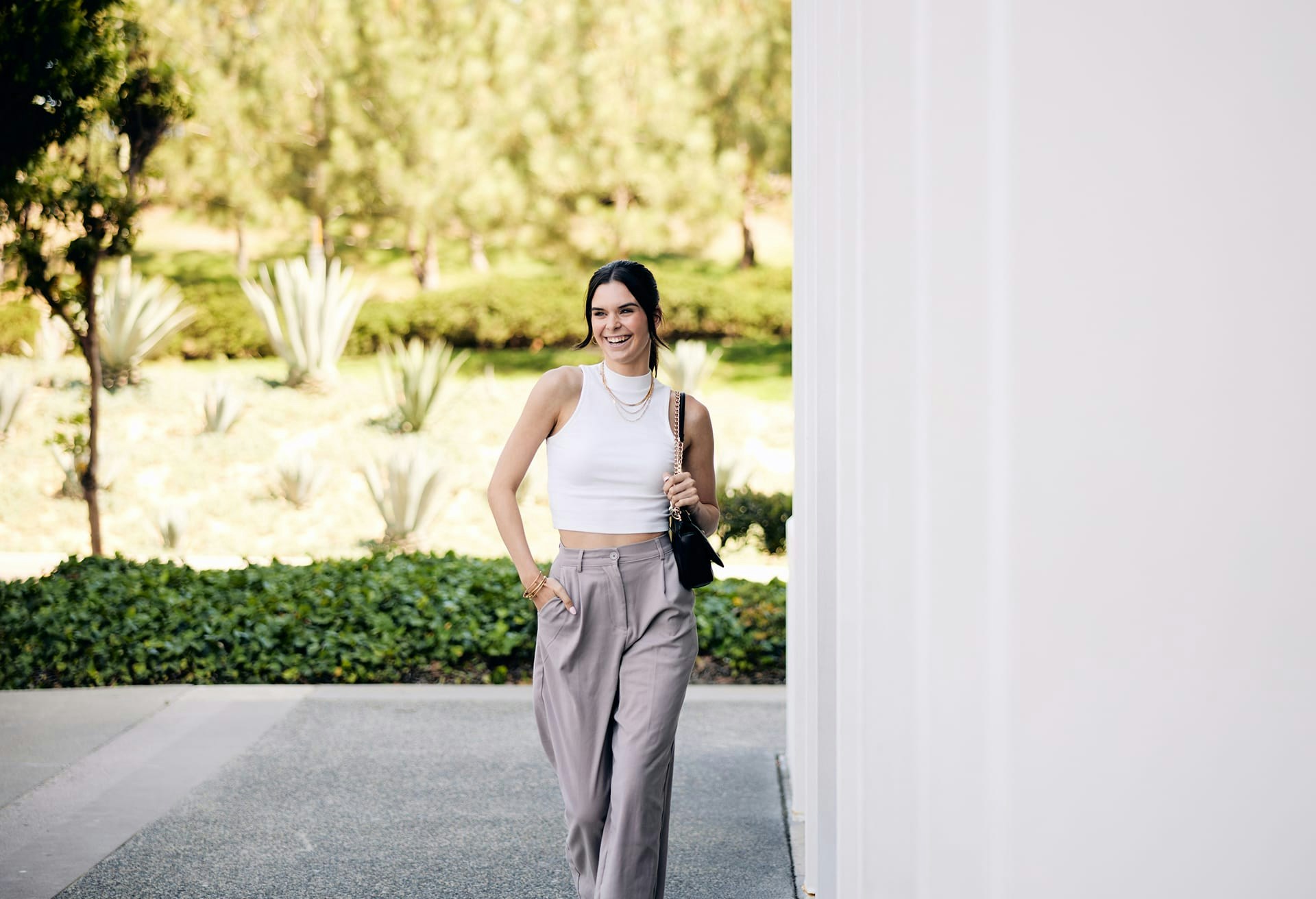 Woman Walking and Smiling Outside