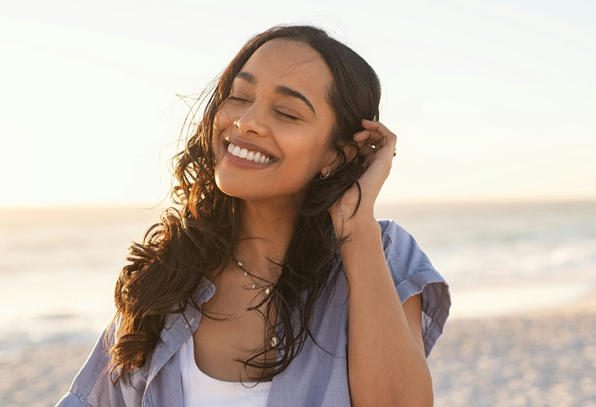 Woman Smiling on the Beach