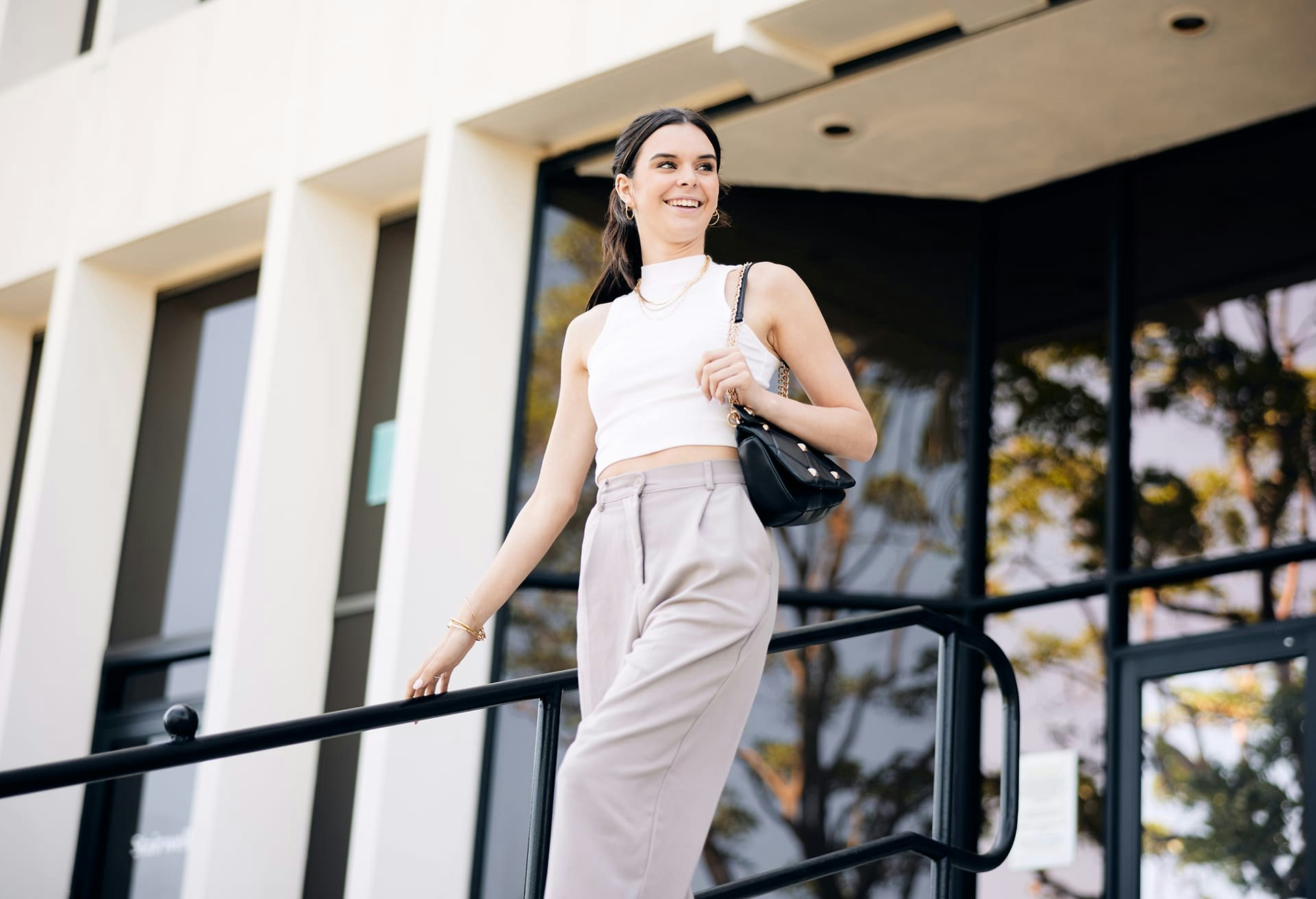 Woman Walking Outside of a Building