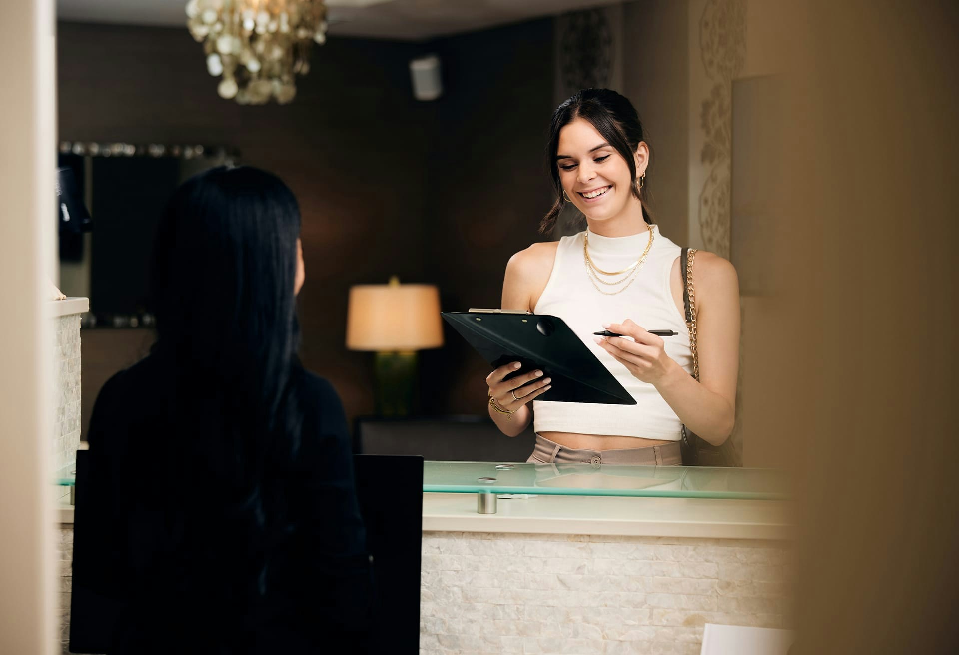 Woman Filling Out Paper Work