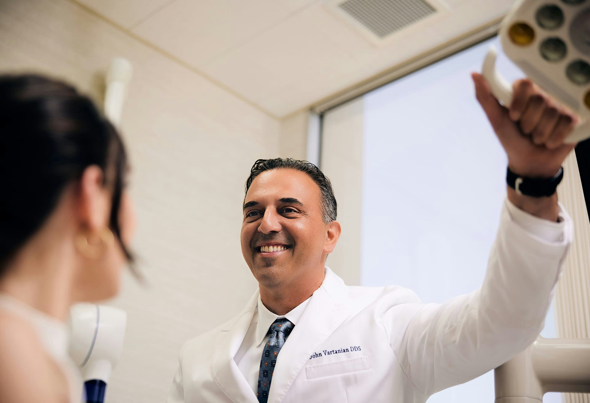 Dr. Vartanian Smiling with a Patient