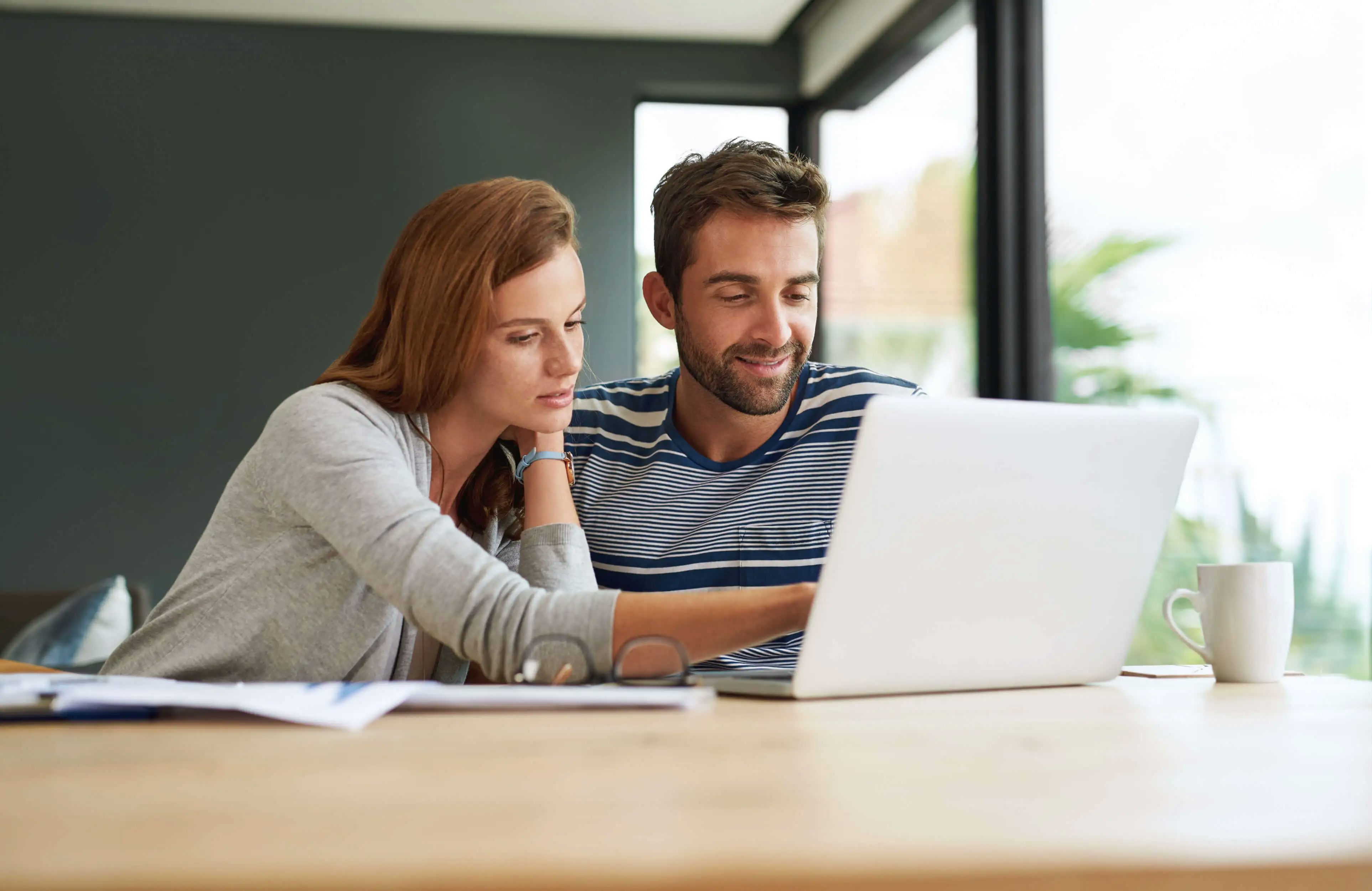 home-couple-laptop-finance-income-planning-budget-accounting-research-life-insurance-internet-apartment-man-with-woman-computer-conversation-investment-email-2