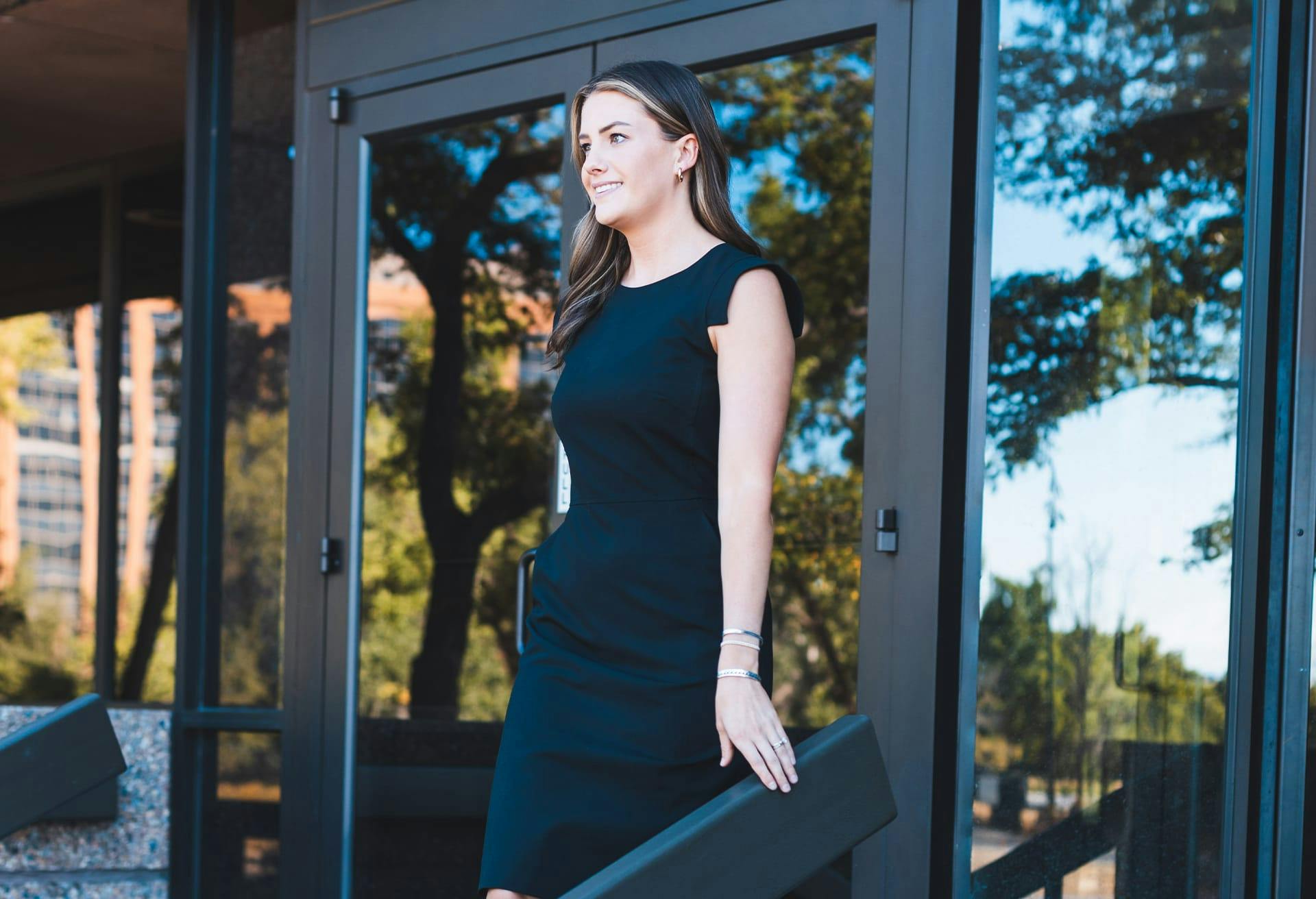 Woman Walking Down a Staircase Outside