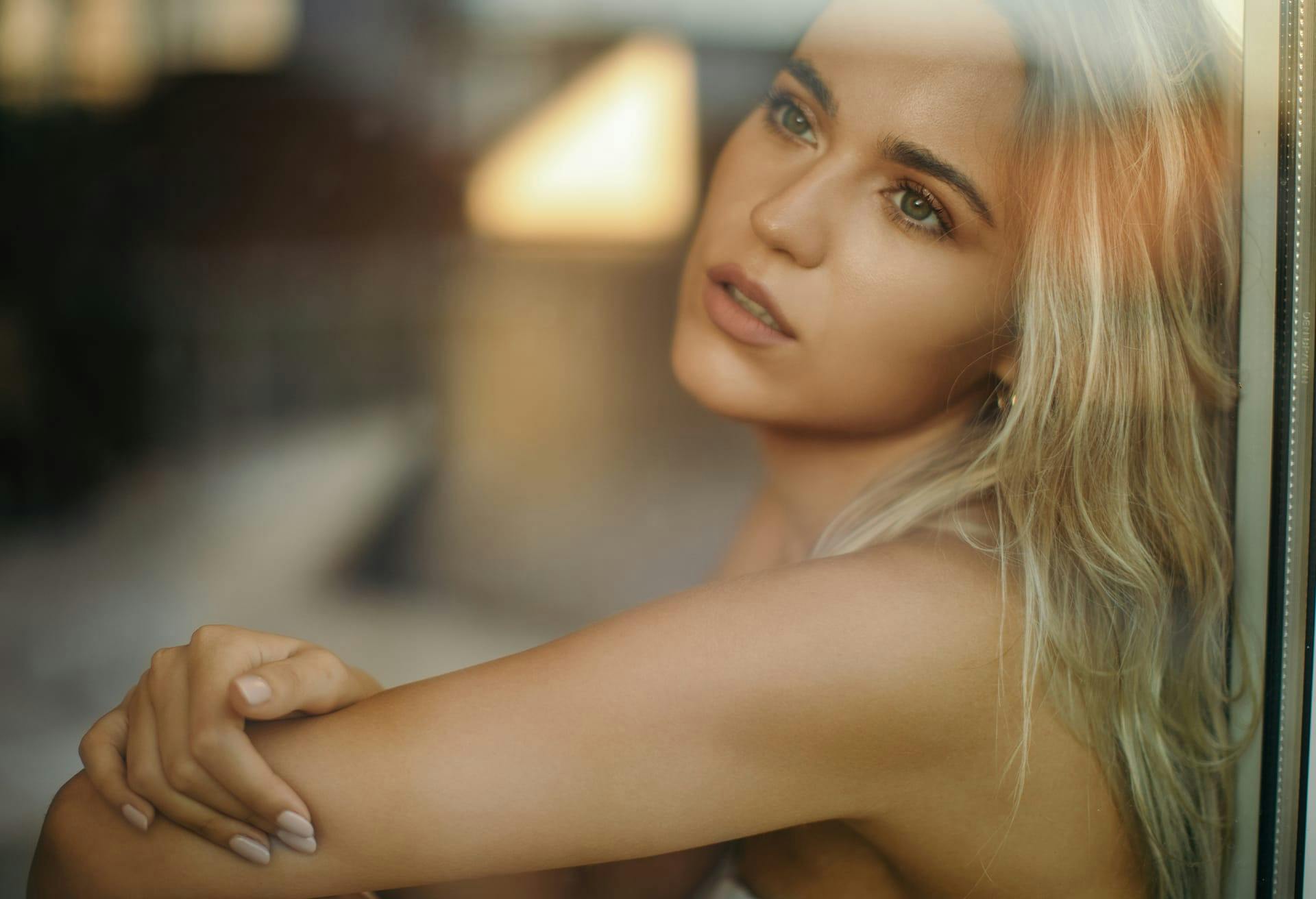 Woman Looking Out the Window