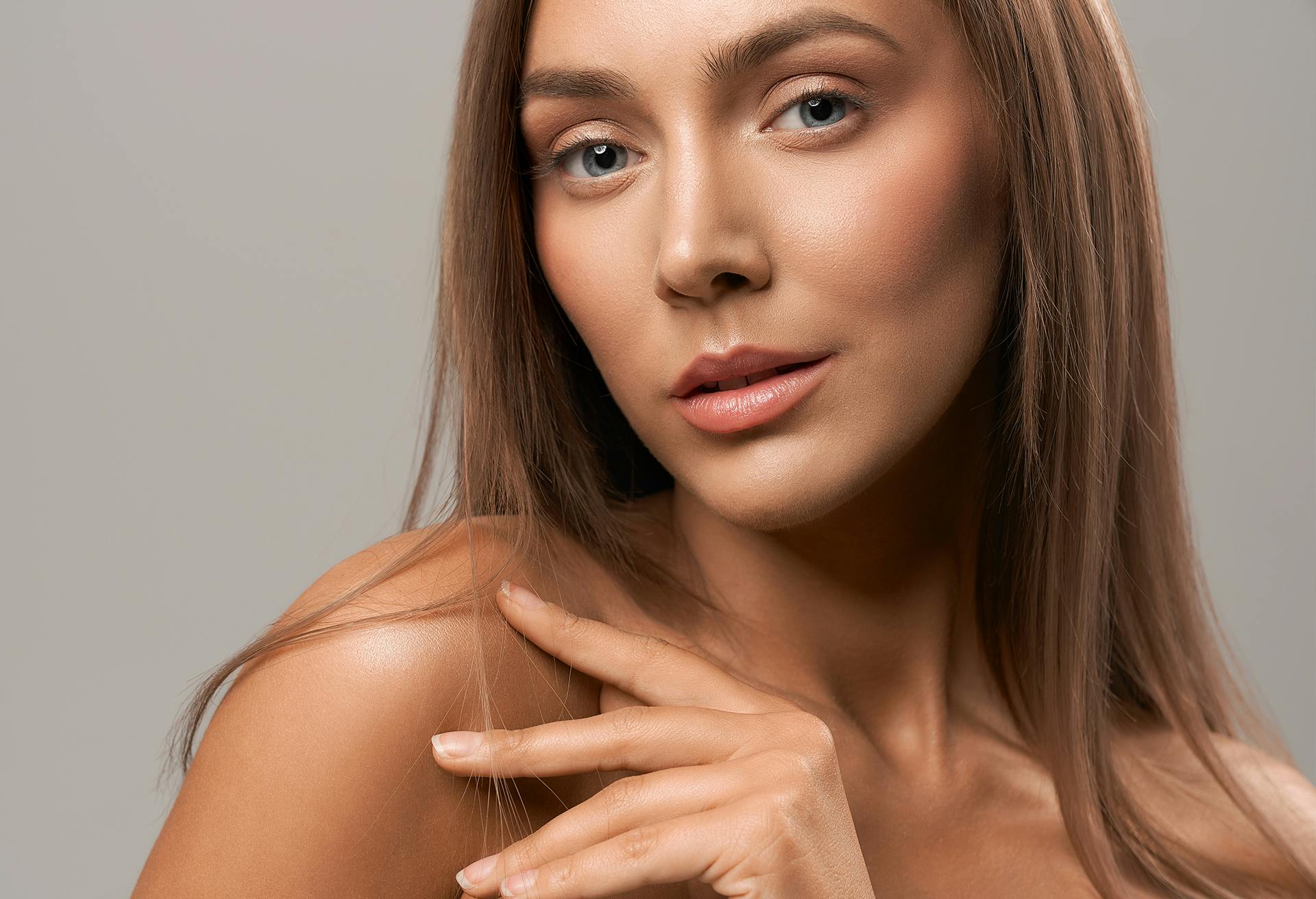 Closeup of Woman Lifting Her Shoulder