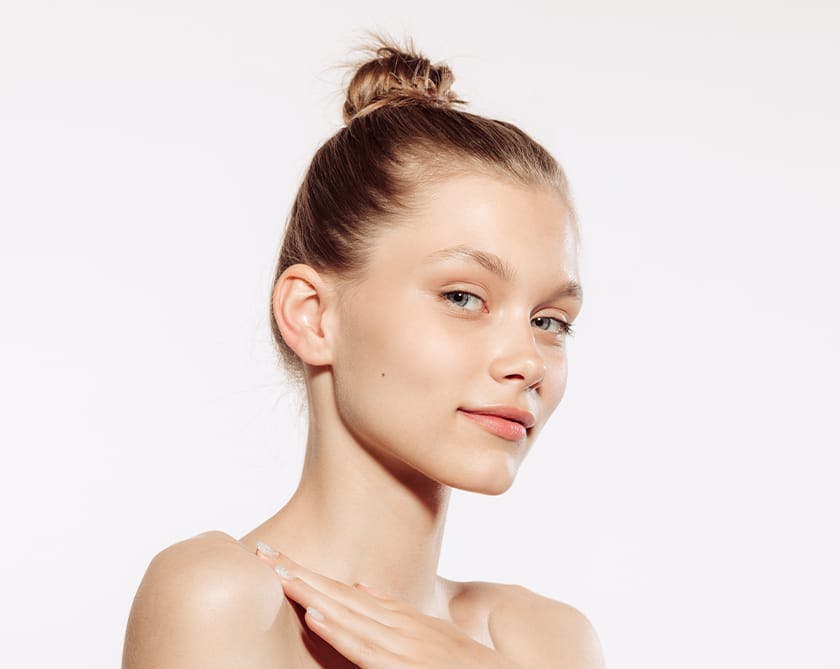 Woman with freckles and defined cheeks after cheek augmentation