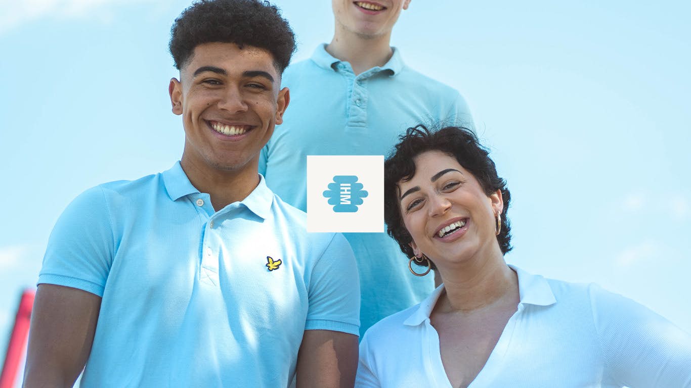 Three people smiling behind the logo of Inhouse Marketeers