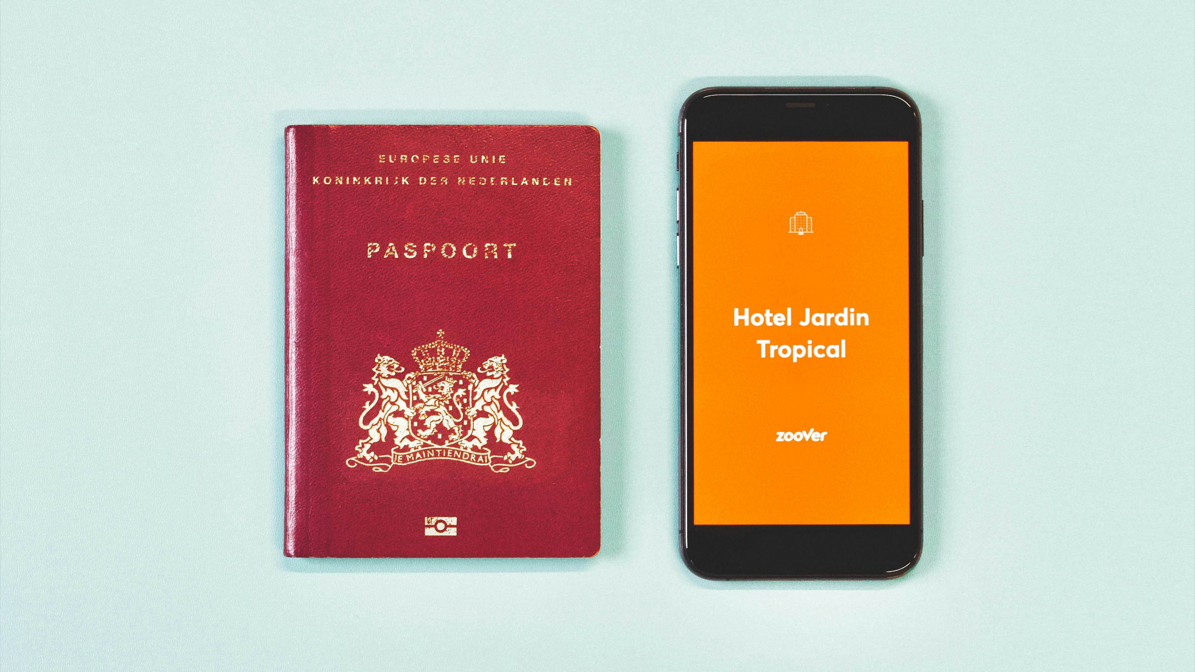 A passport and a phone with a automated video placed on a blue-green greyish background