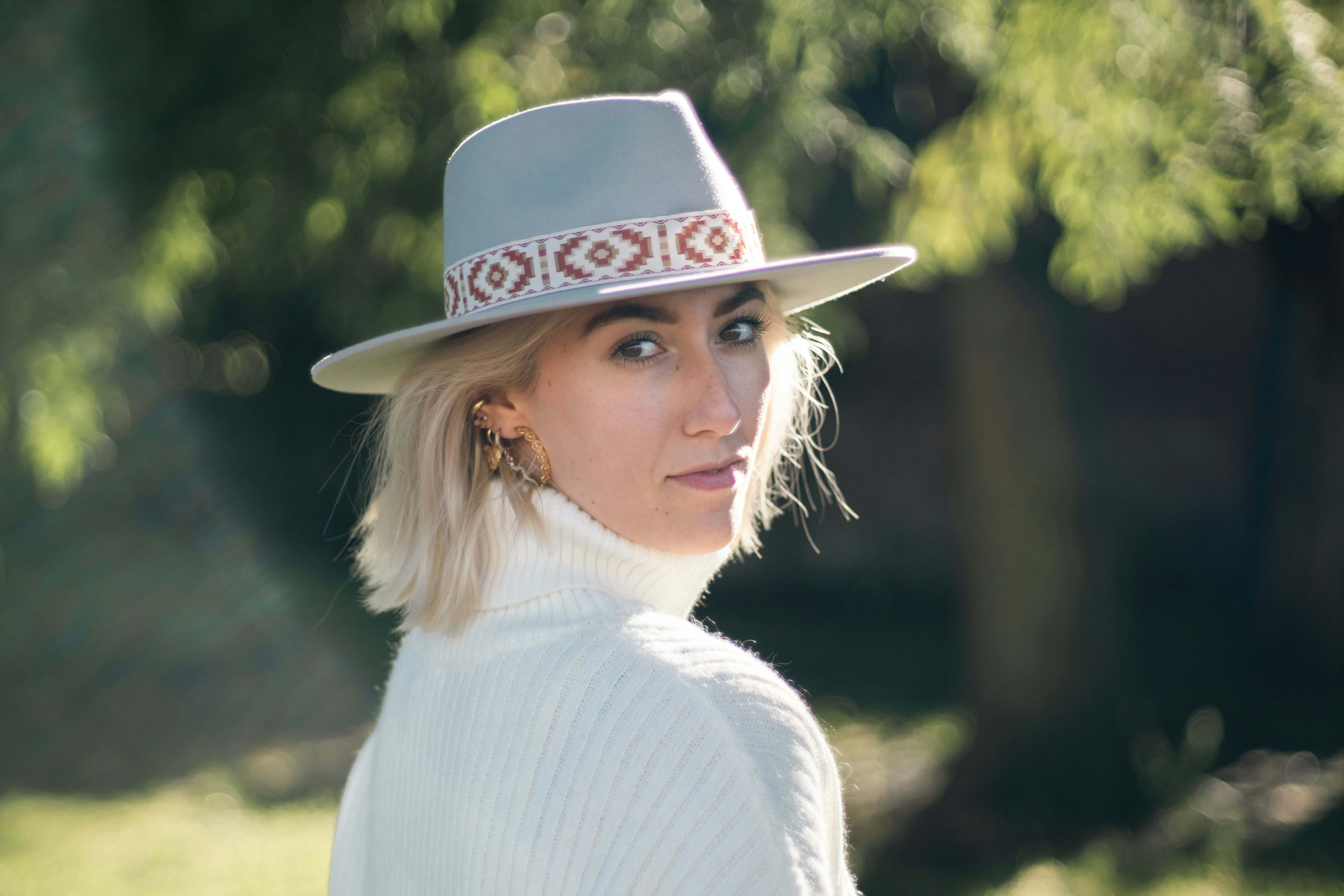 Woman looking into the camera with a blurry background