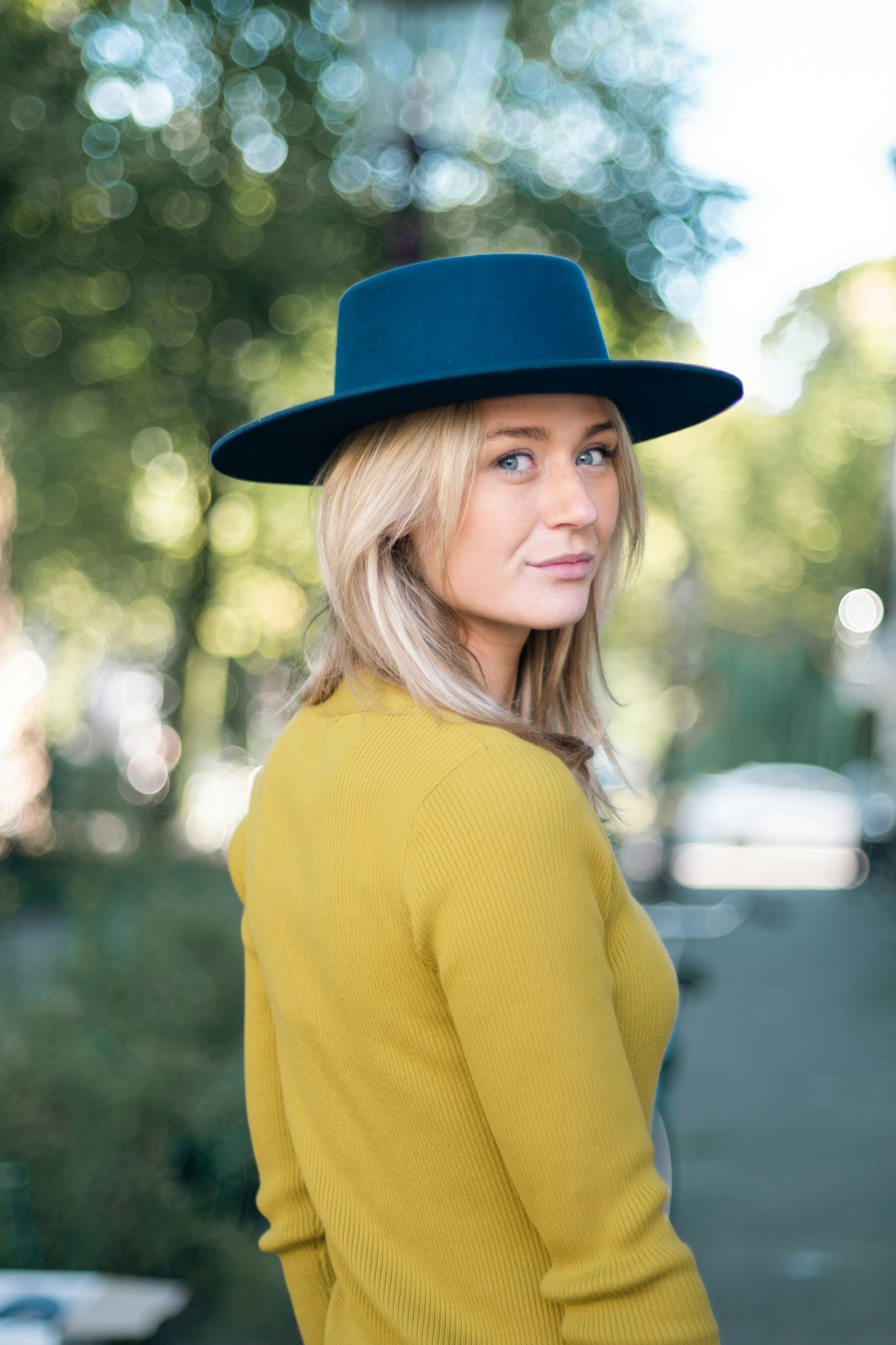 Woman looking into the camera with a blurry background