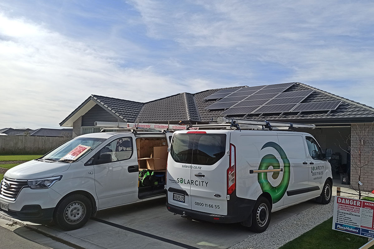 solarcity installing panels and battery at a customer's home.