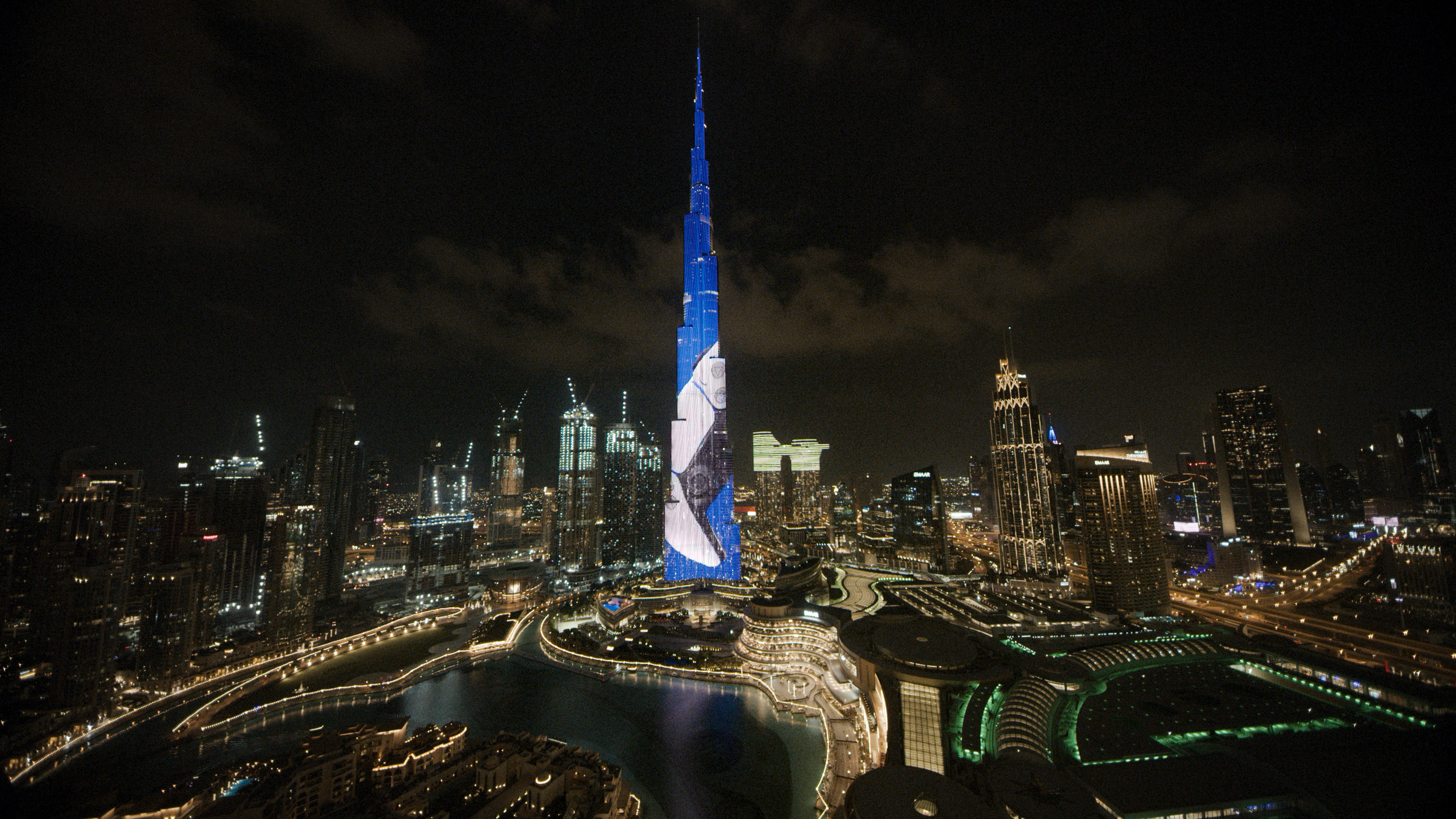 The Burj Khalifa in Dubai lit with the PlayStation 5 launch display across the night skyline.