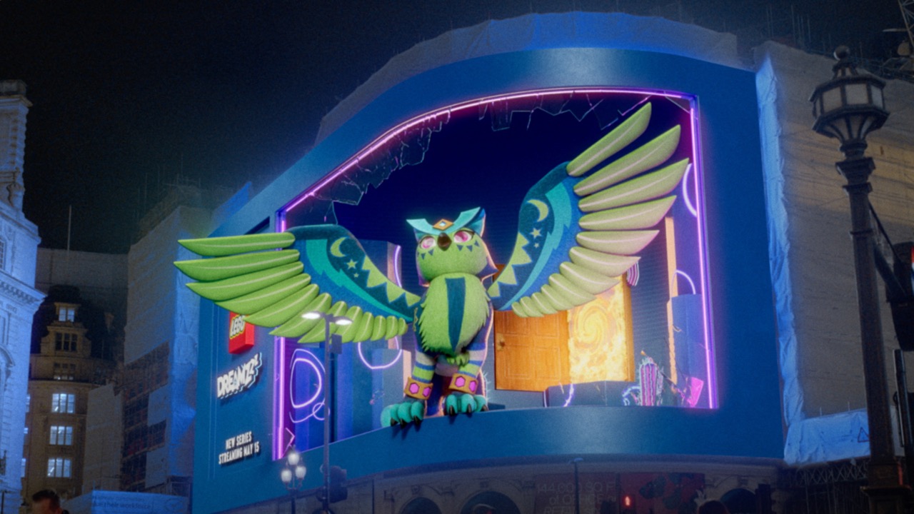 A curved London billboard where a winged LEGO DREAMZzz owl creature appears to fly out of a neon doorway.