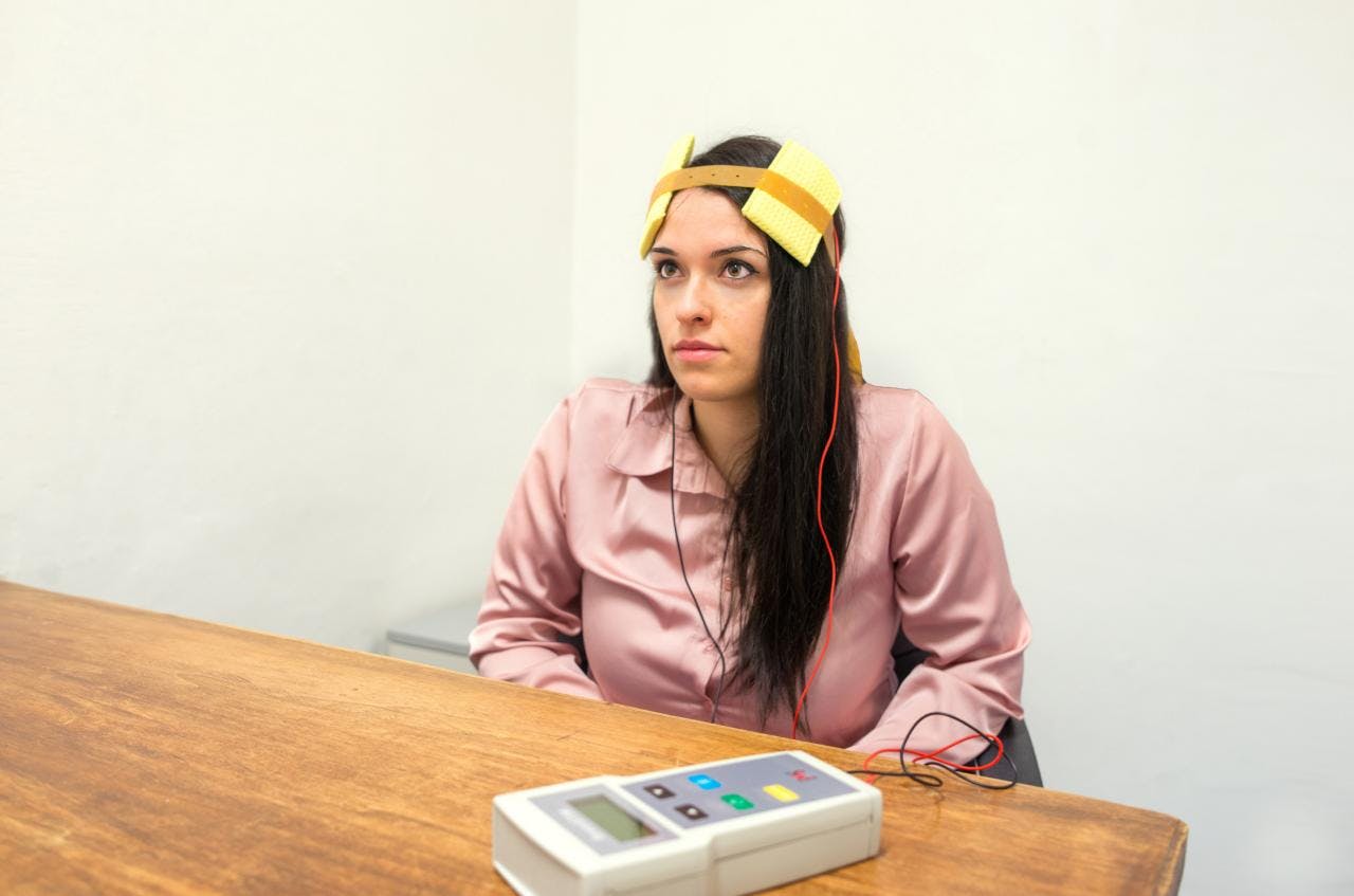 Woman during a tDCS therapy session at the Istituto di Neuroscienze.