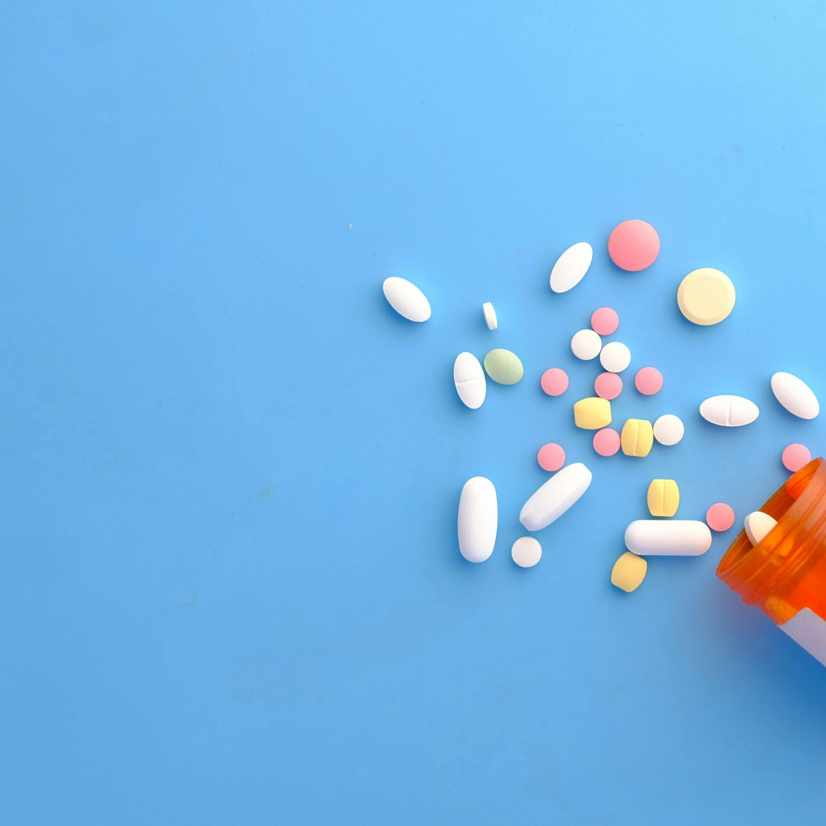 orange and white medication pill