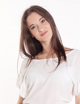 Brown girl smiling on white background