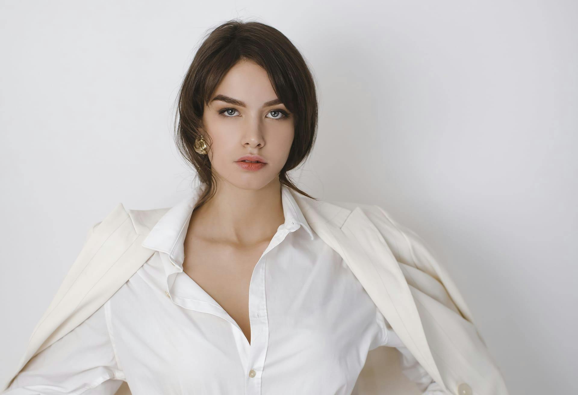 Woman in white white shirt and coat